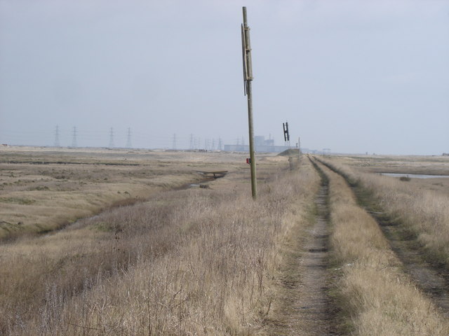 Boundary_of_Lydd_firing_ranges_-_Dungeness_nuclear_power_station_in_the_distance_-_geograph.org.uk_-_1170858.jpg