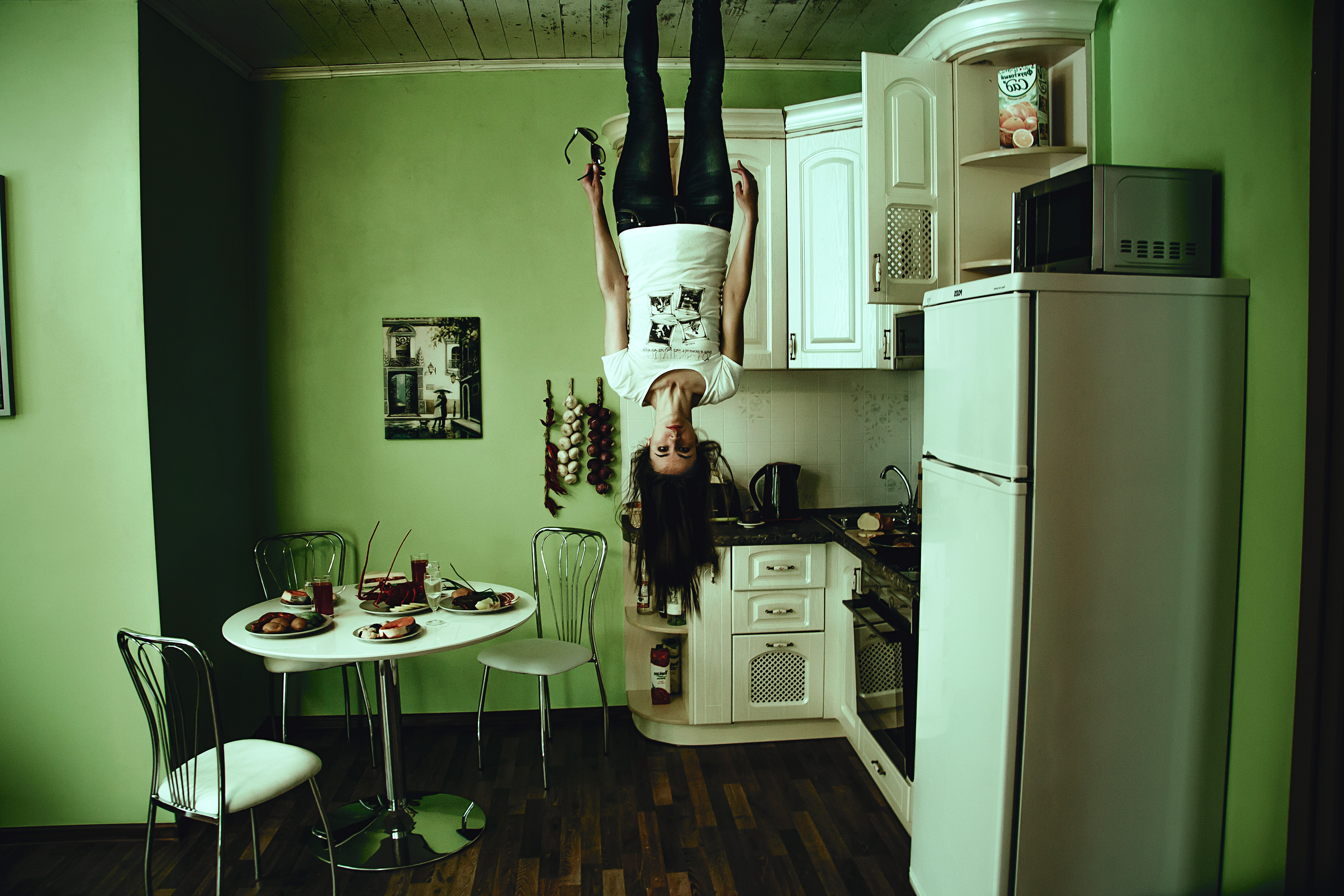 girl-standing-upside-down-from-the-roof.jpg
