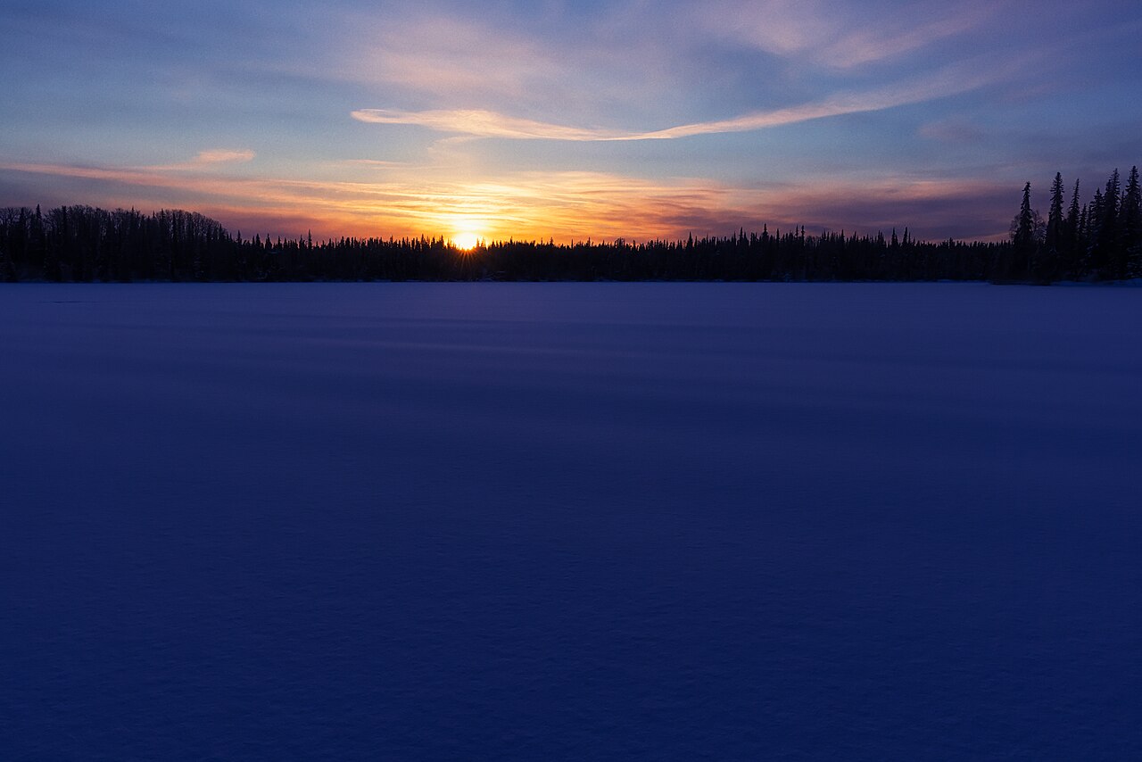 Sunrise_over_the_snowy_lake_(51080465852).jpg